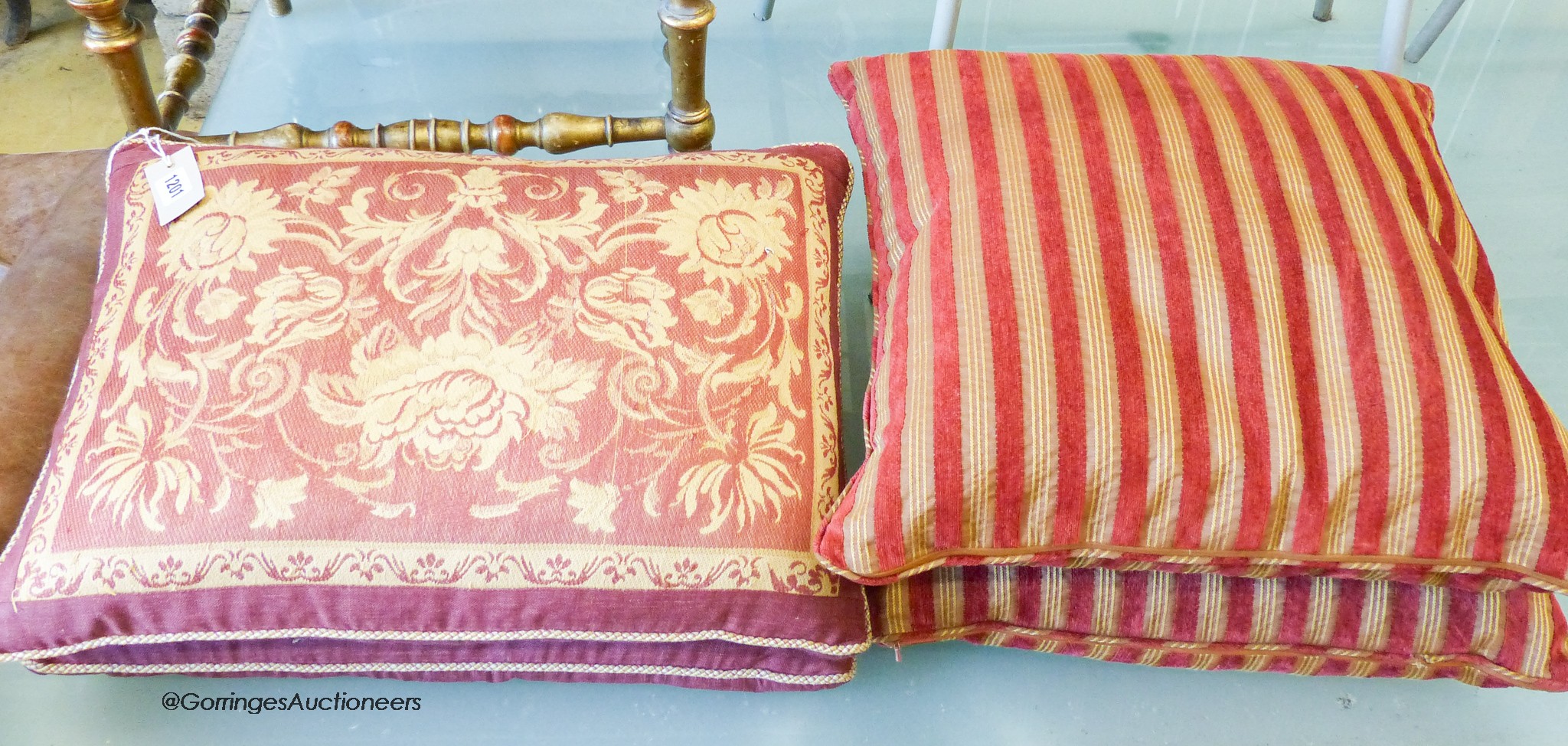 A pair of Laura Ashley rectangular feather filled cushions, 54 x 38cm together with a pair of square feather cushions